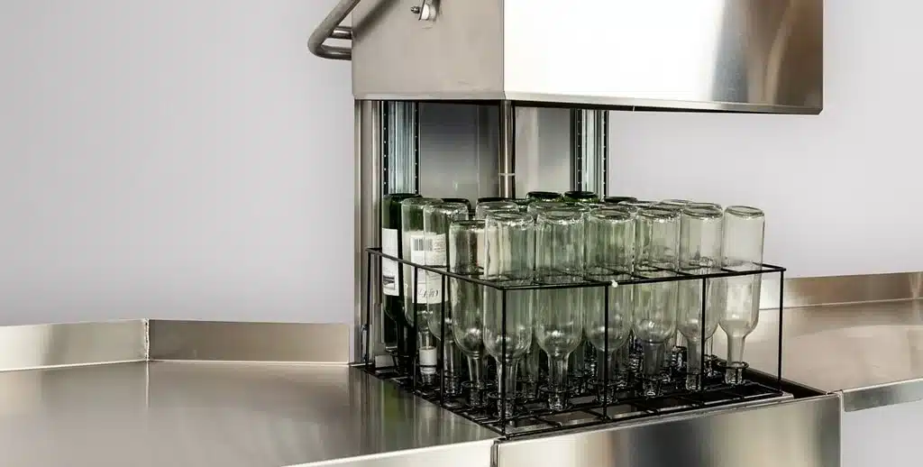 Clean the bottles in and out by scrubbing well the residues and bacteria
