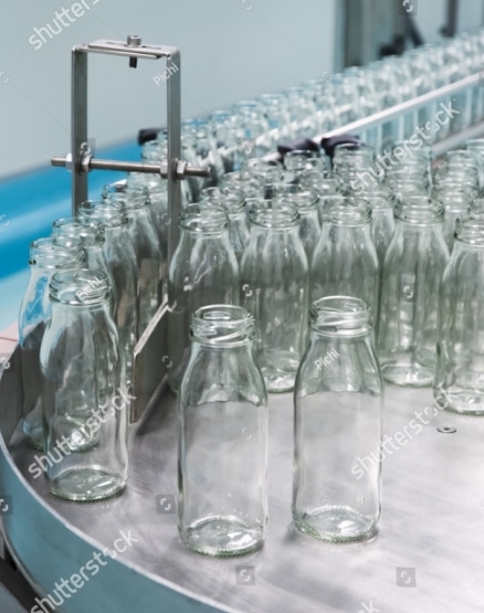 stock-photo-glass-bottles-on-the-conveyor-belt-187530245